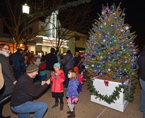 Families enjoy the annual tree lighting ceremony at Roosevelt Center on December 4, 2015. The ceremony  location was moved from the Community Center lawn to Roosevelt Center this year. Photo by Sharon Natoli