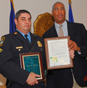 Mayor presents award to Policeman of the Year, Mark Holden.