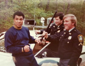 Muhammed Ali in Greenbelt with Officers James Craze and Paul Duprat, Photo by Bob Daugherty