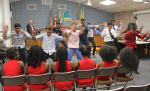 Dem Raider Boyz show off their skills to a delighted City Council. Visible are (left to right) Marqui Williams, Anthony Matthews, Elijah Achu, Elijah Virachittevin, Daniel Shaibu, Antonio Meighoo, Alfred Walfall and Noah Absalon.  Photo by Imani Jackson