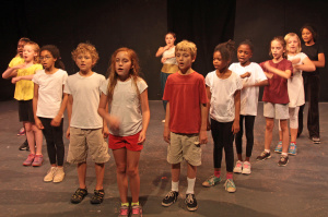 Campers sing "Take a tumble for love." Photo by Jon Gardner