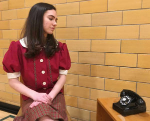 Sally Jones (played by Elta Goldstein) is hoping for a phone call. In January of 1938, less than half of the homes in Greenbelt had telephones. The musical is part of the Greenbelt Legacy 80th Anniversary celebration.