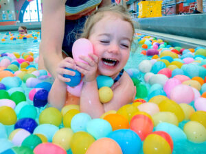 2-year-old in the pool with eggs
