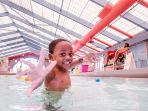 A happy kid in the pool