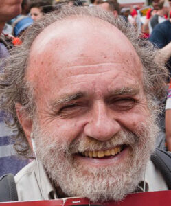 Bill Orleans, a smiling white man with a gray-white beard and balding head. Photo by Eric Zhang.