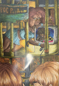 Art piece: a wistful, sad brown-skinned woman with voluminous hair and star-pattern makeup, in a blue crop-top and skirt with fishnet stockings, is in a cage with green bars. She holds a drooping microphone and rests against a TV that seems to depict herself in better days. A sign on the cage reads POC Pop Artist and has smaller text below. Outside the cage, in the foreground, you see two blond heads looking toward it. 