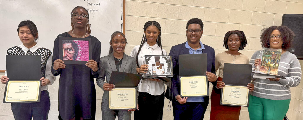 Six student winners and one student's mother (representing her daughter) stand side by side holding certificates. The three Visual Arts winners also hold and display their winning artworks.
