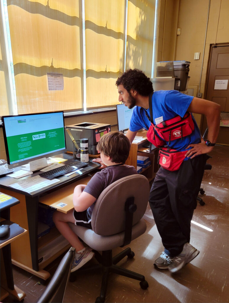 Counselor helps camper